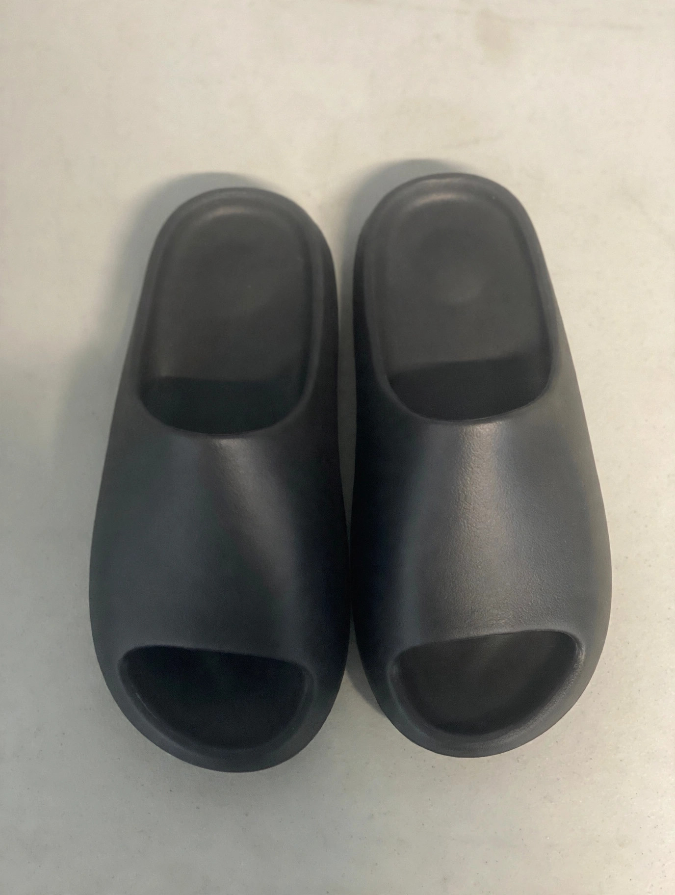 Black YS-01 Onyx slides inside their packaging bag