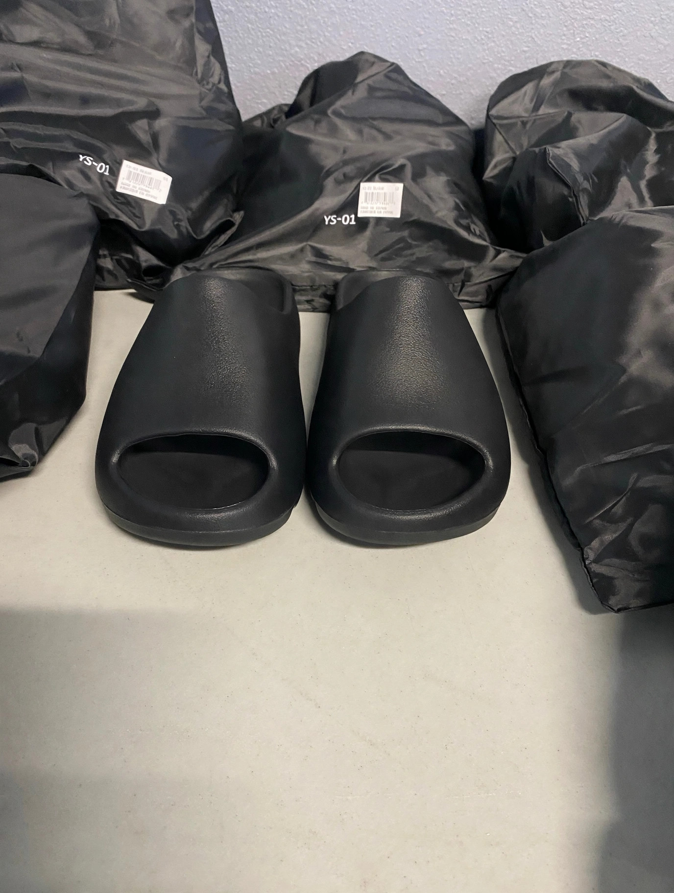 Pair of black YS-01 Onyx slides viewed from the front